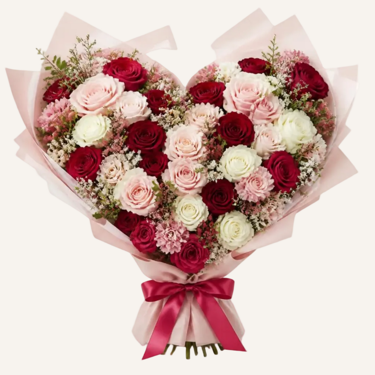 Heart-shaped bouquet with red, blush and white roses